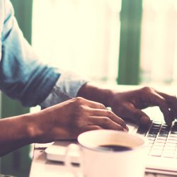 Hands using laptop